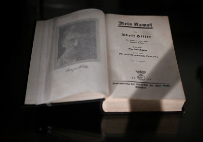 Open book with text and portrait of Hitler